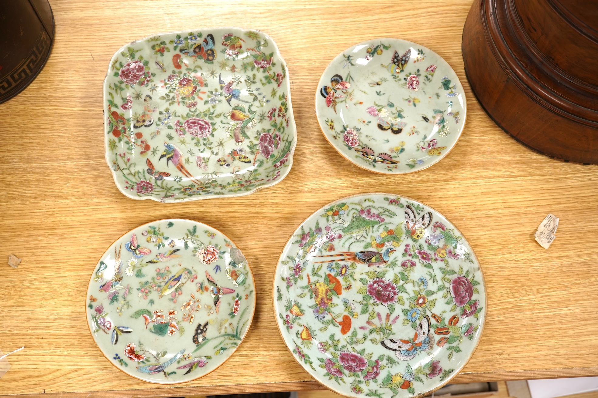 Four 19th century Chinese famille rose celadon ground dishes, largest 25cm